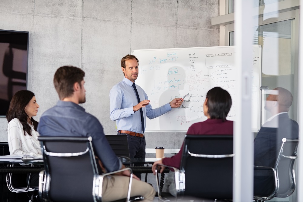 Businessman giving presentation with colleagues